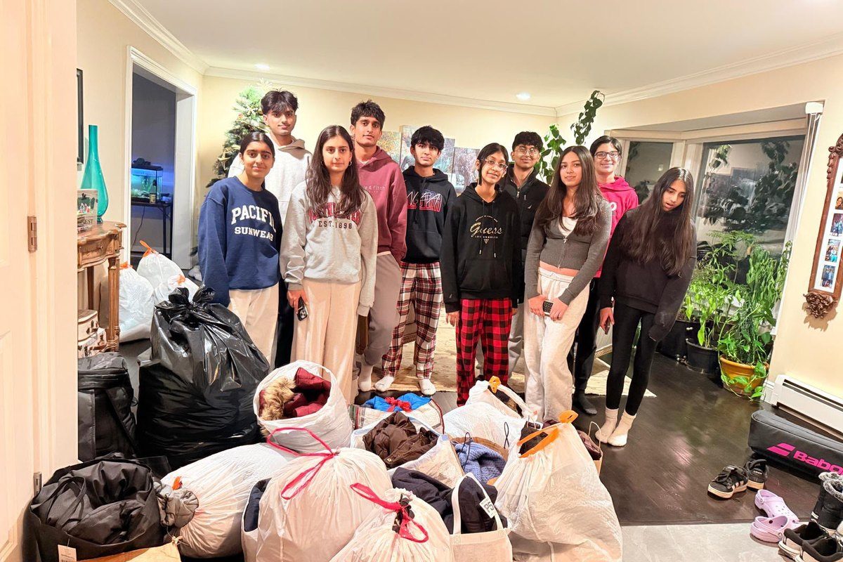 Volunteers with the bagged coats collected for the drive