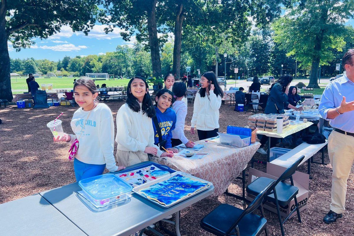 Volunteers running the craft table at Fall Fiesta