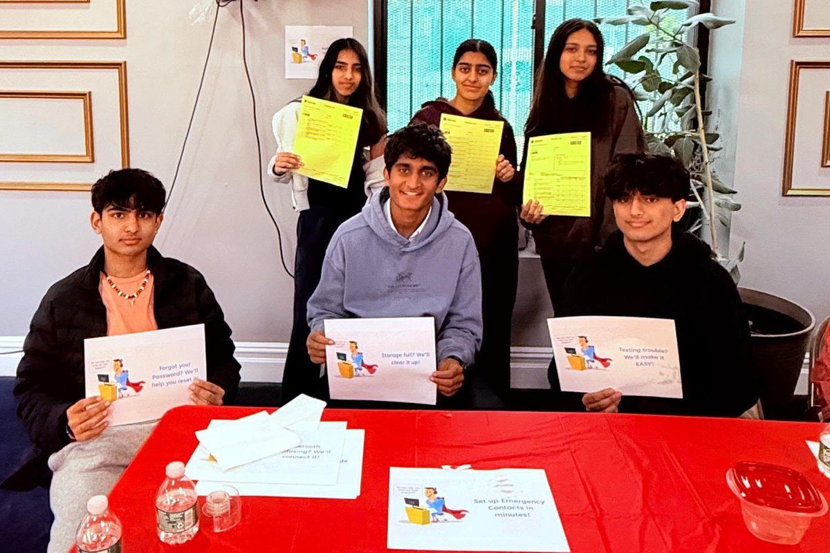 Student volunteers at the tech help desk
